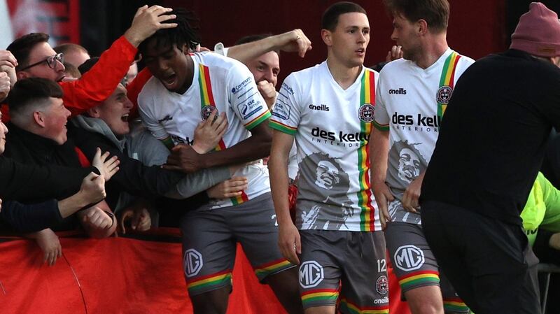 Bohemians’ Promise Omochere celebrates with the home fans after Dawson Devoy’s goal at Dalymount Park. Photograph: Tom Maher/Inpho