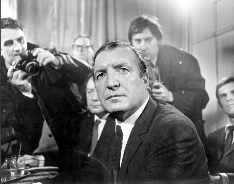 Charles Haughey is flanked by photographers at a press conference in Dublin, following his acquittal in the Arms Trial in October 1970.