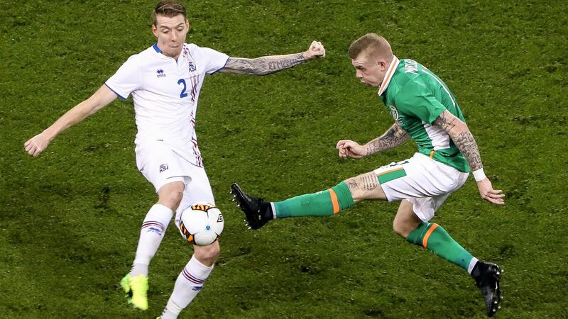James McClean blocks down Birkir Mar Saevarsson. Photo: Tommy Dickson/Inpho