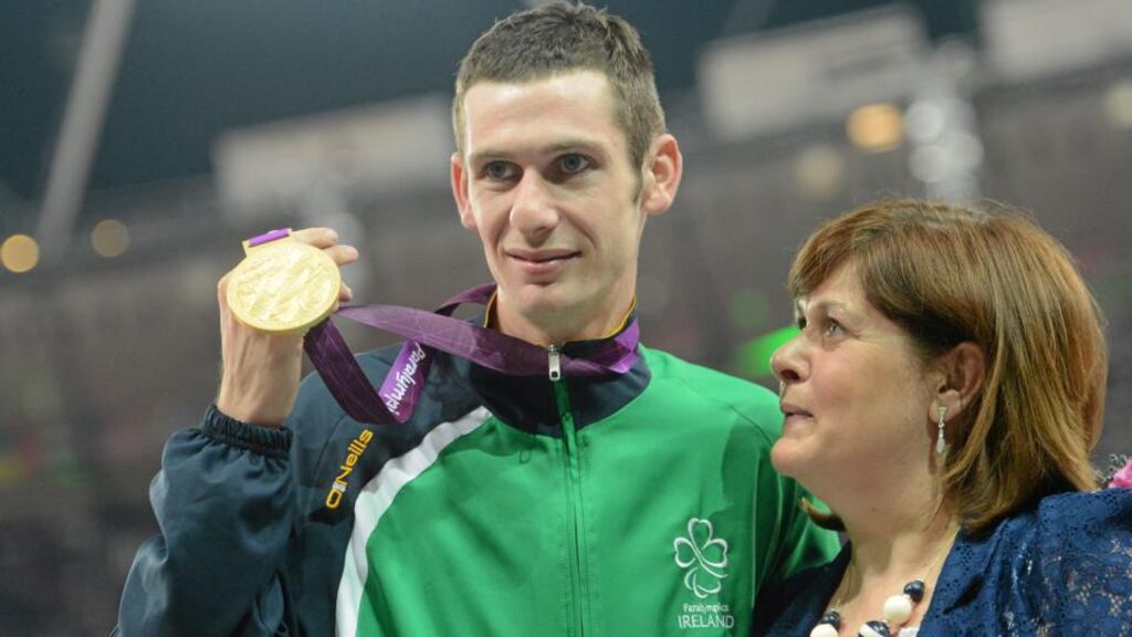 Irish Paralympic champion Michael McKillop with his mother Catherine at London 2012 after she presented him with his gold medal