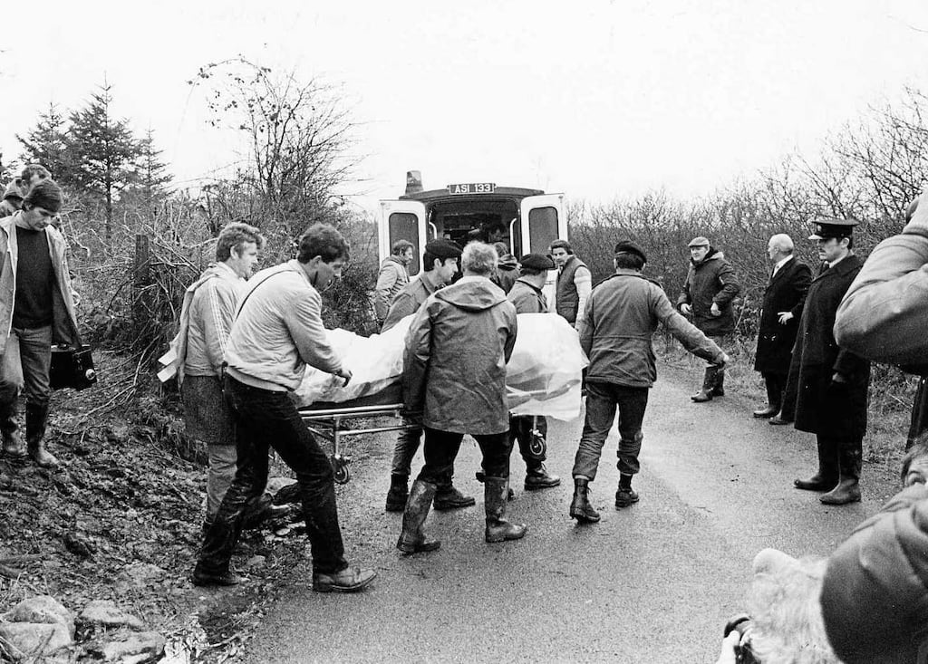 The bodies of Private Patrick Kelly and Garda Peter Garry Sheehan being removed from Derrada Wood in December 1983. Photograph: Pat Langan