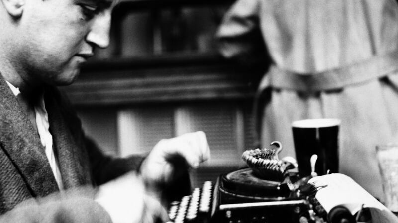 Brendan Behan at work in a pub, August 1952. Photograph: Hulton-Deutsch Collection/Corbis via Getty Images