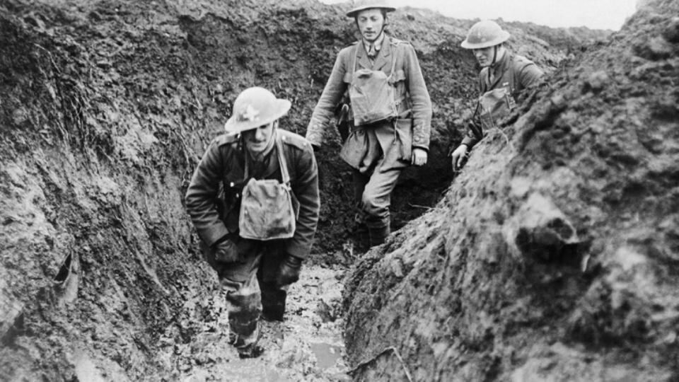 During the winter, as snow melted and rain fell, or in areas that had suffered severe bombardment, movement was difficult in the mud. Pictured are a chaplain and officers of the Royal Irish Rifles in February 1918 slogging through the liquid mud that has built up at the bottom of a trench. (Courtesy of the Imperial War Museum, Q 10681)