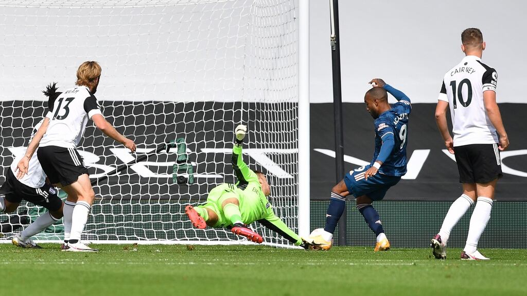 Alexandre Lacazette scores the opening goal of the new Premier League season. Photograph: EPA