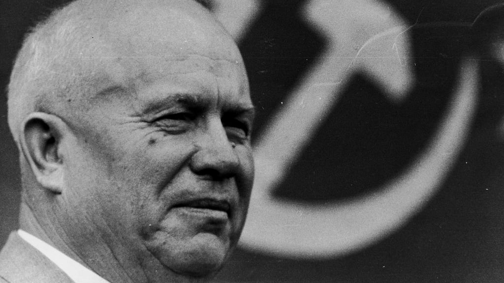 Former Soviet premier Nikita Khrushchev with the hammer and sickle symbol behind him. Photograph: Express