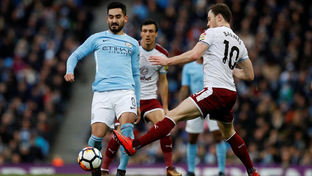 Manchester City’s Ilkay Gundogan in action with Burnley’s Ashley Barnes on Saturday. Photograph: Phil Noble/Reuters
