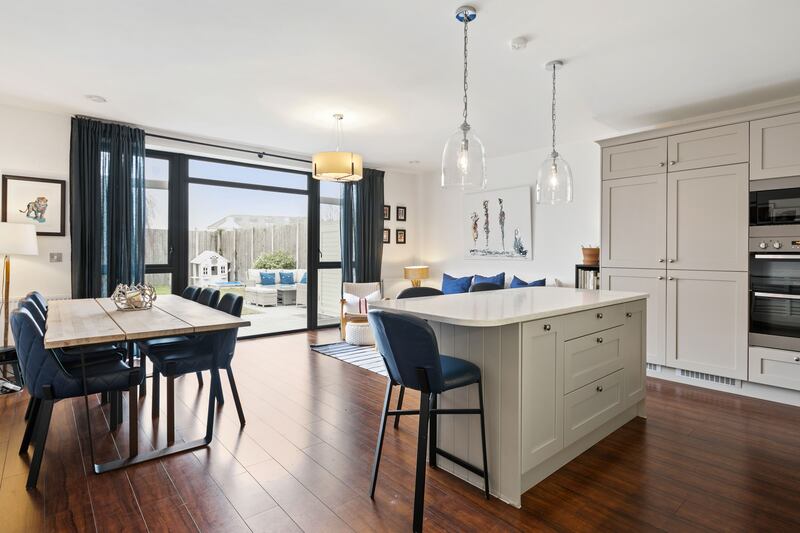 Most of the family living takes place in a large open-plan kitchen/dining/living area, overlooking the garden on the ground floor.