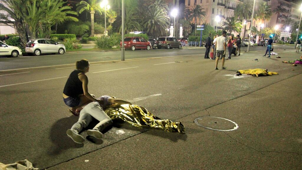 Thermal covers and blankets cover the dead and injured after a heavy truck ran into a crowd celebrating Bastille Day on the Promenade des Anglais in Nice. Photograph: Tarubi Wahid Mosta/Reuters