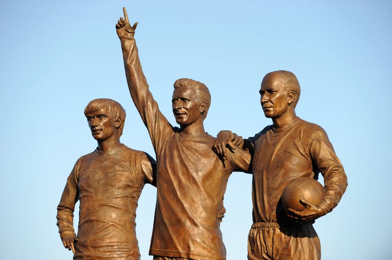 The statue of Manchester United's 'holy trinity' – George Best, Denis Law and Bobby Charlton – outside Old Trafford Stadium. Photograph: AMA/Corbis via Getty Images