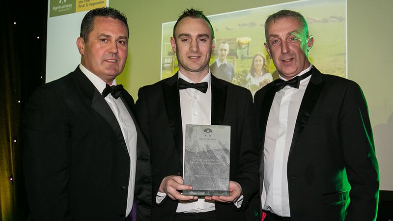 David McMahon, CEO, ABP Food Group presents the Agribusiness of the Year – Fresh Fruit & Vegetables awards to Robert Devlin and Patrick Meade, Meade Potato Company