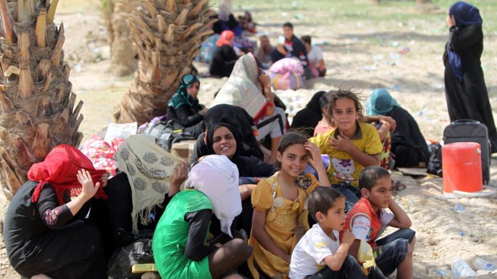 Iraqi families, who fled the city of Ramadi after it was seized by Islamic State, waiting to cross Bzeibez bridge on the southwestern frontier of Baghdad on Friday.  Photograph: Ahmad al-rubaye/AFP/Getty Images