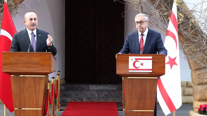 Turkish foreign minister Mevlüt Çavusoglu (L) with president of Northern Cyprus Mustafa Akinci at a joint press conference in the Turkish Cypriot northern part of the divided city of Nicosia, Cyprus. Photograph:  EPA/Andreas Manoli