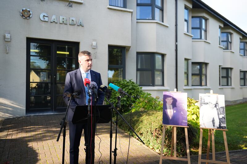 Inspector David Pinerty stands beside photographs on display of Patrick Nugent, 23, as he makes a fresh appeal for information at Shannon Garda Station into his death. Photograph: Niall Carson/PA Wire