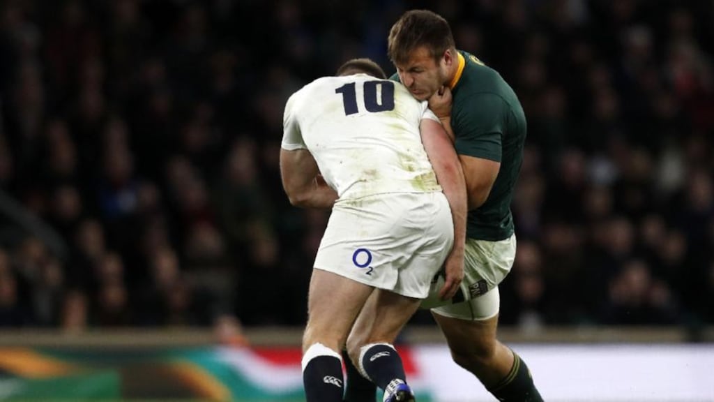 England’s outhalf Owen Farrell makes a dubious tackle on South Africa’s Andre Esterhuizen late in England’s win at Twickenham on Saturday. Photo: Adrian Dennis/Getty Images