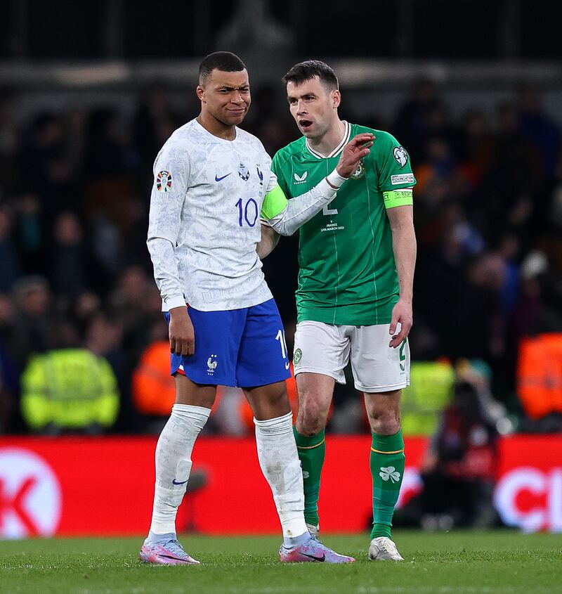 France's Kylian Mbappé is shadowed by Ireland's Seamus Coleman during the Euro 2024 Group B fixture at the Aviva Stadium in March.
