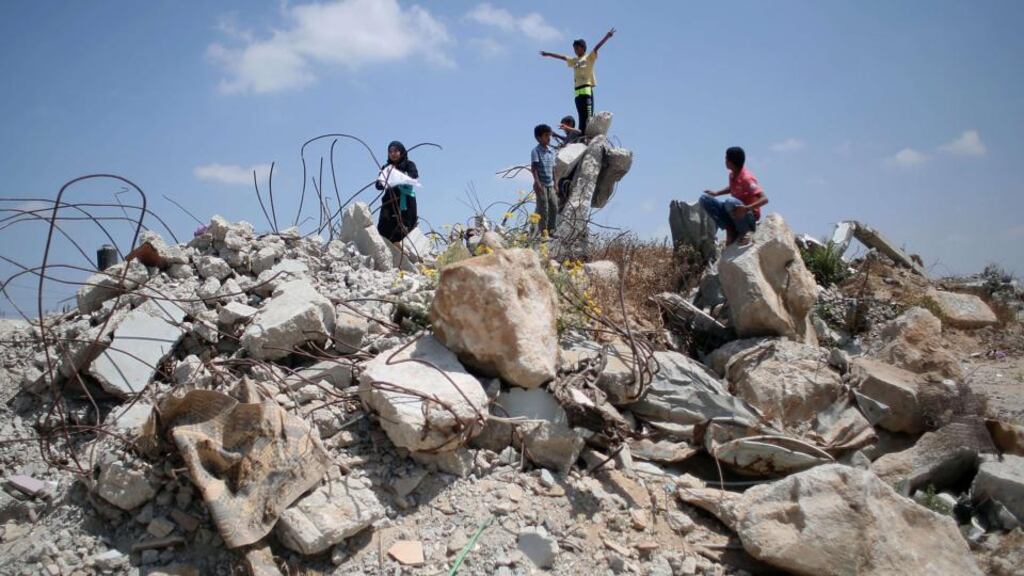 Out of this desperation will IS find a base? .... Palestinian children play in the rubble of houses destroyed during the Gaza war between Israel and Hamas militants in the summer of 2014 Photograph: Said Khatib/AFP/Getty Images