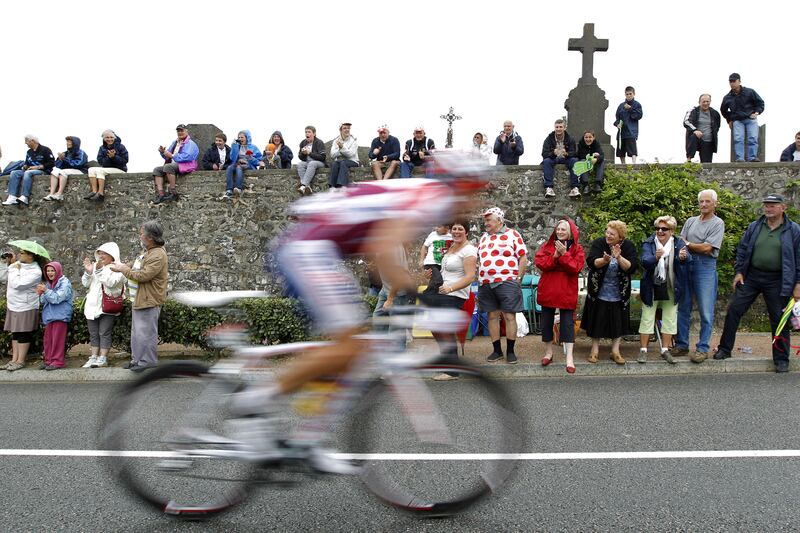 Fans look on in Evaux-les-Bains during the eighth stage of the 2011 Tour de France. Photograph: Joel Saget/AFP via Getty Images