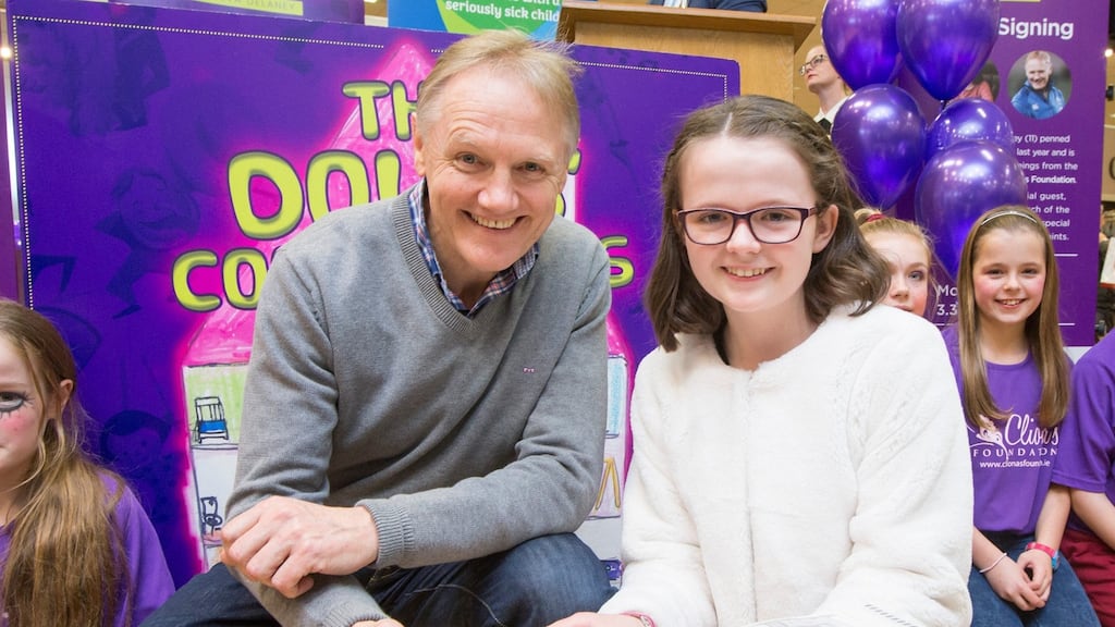 Author Keeva Heffernan (12) with Ireland rugby coach Joe Schmidt on Monday. All proceeds from her book, The Dolls’ Complaints, will go to the charity Cliona’s Foundation. Photograph: Liam Burke/Press 22