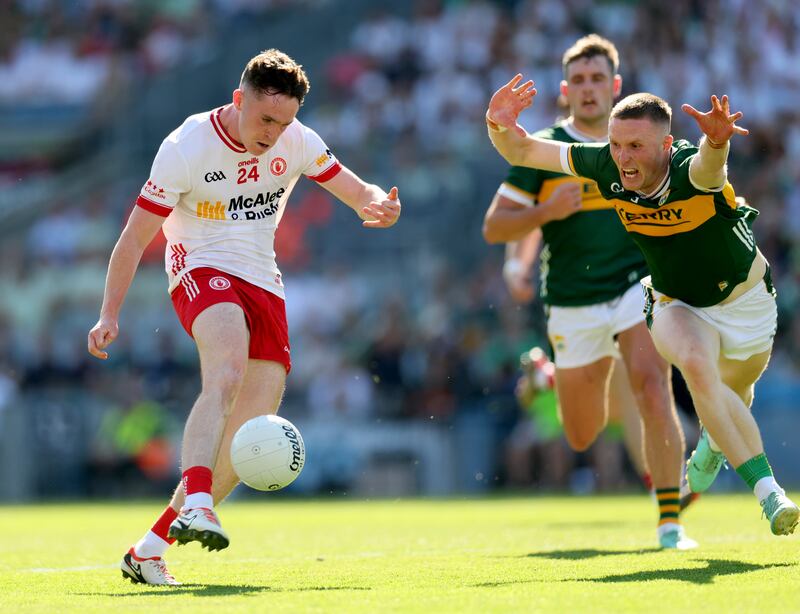 Jason Foley of Kerry attempts to block an effort from Tyrone's Eoin McElholm during the semi-final at Croke Park. Photograph: James Crombie/Inpho