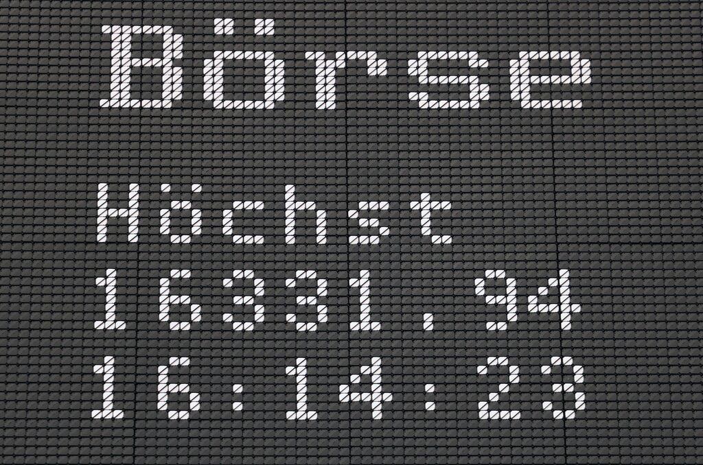 A display showing the German stock index DAX in Frankfurt. It reached a record high on Friday. Photograph: Daniel Roland/AFP