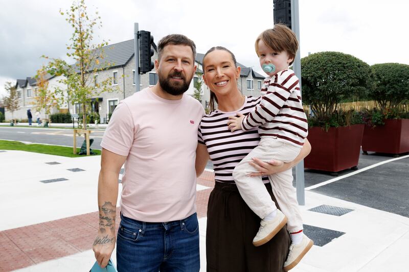 David Rooney, Paige O’Brien and son Casey outside Mason Cross, a new development on the outskirts of Newcastle village, Co. Dublin