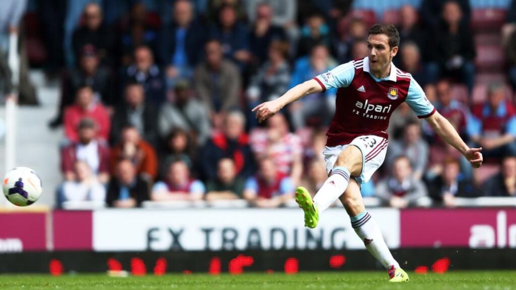 Stewart Downing of West Ham scores his team’s second goal from a free kick during the Premier League match against Tottenham Hotspur at the Boleyn Ground. Photograph: Paul Gilham/Getty Images