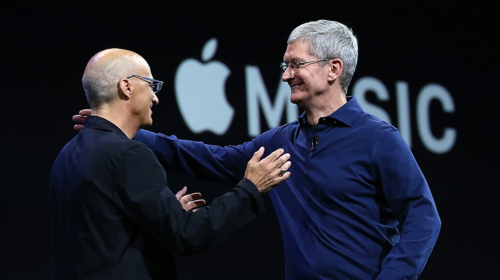 Apple CEO Tim Cook (right) greets Jimmy Iovine during Apple's developer conference in San Francisco, California. Iovine brought record-label smarts to the company, but it hasn't helped them innovate in the streaming market. (Photo by Justin Sullivan/Getty Images)