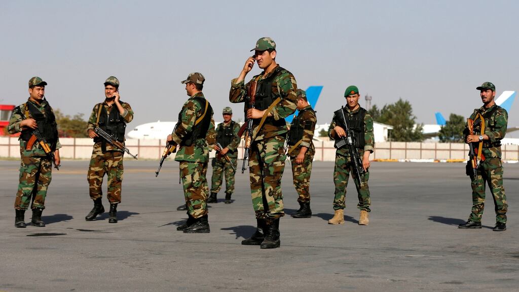 Afghan Vice President Abdul Rashid Dostum's security guards wait for his arrival at the Hamid Karzai International Airport in Kabul, Afghanistan, July 22, 2018.REUTERS/Omar Sobhani