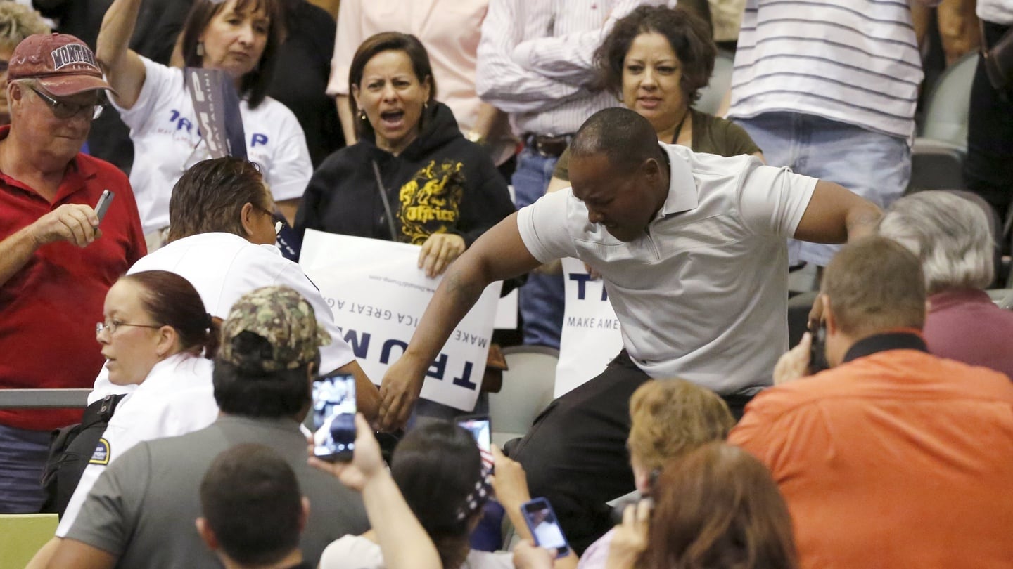 A member of the audience (right) stomps on a protester as Republican presidential candidate Donald Trump speaks during a campaign event in Tucson, Arizona on Saturday. Photograph: Reuters
