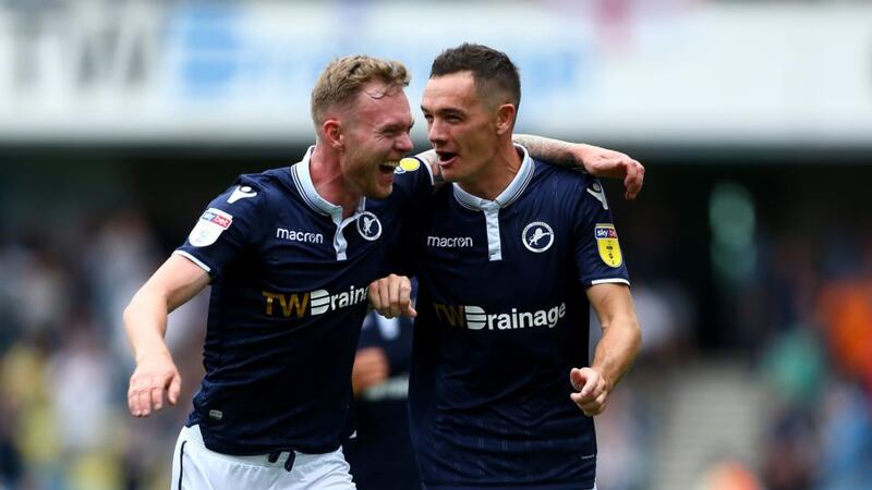 Milwall’s Shaun Williams celebrates scoring his side’s second goal with Aiden O’Brien during the Sky Bet Championship match against Derby County at The Den. Photograph: Jordan Mansfield/Getty Images