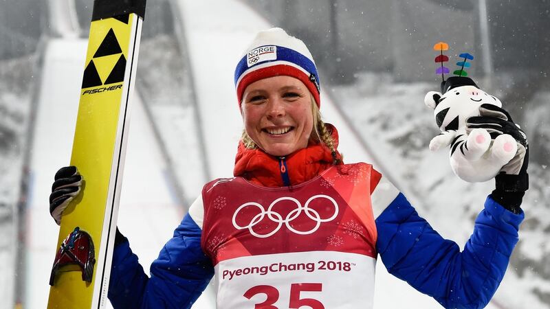 Norway’s Maren Lundby celebrates on the podium during the victory ceremony. Photograph: Jonathan Nackstrand/AFP/Getty Imagess