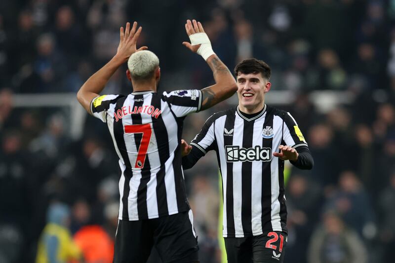 Joelinton of Newcastle United celebrates with teammate Tino Livramento. Photograph: Clive Brunskill/Getty