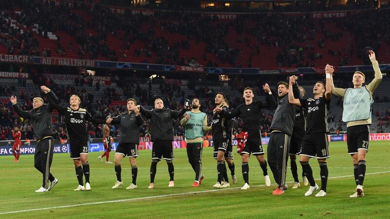 Ajax celebrate their 1-1 draw away to Bayern Munich. Photograph: Christof Stache/AFP/Getty