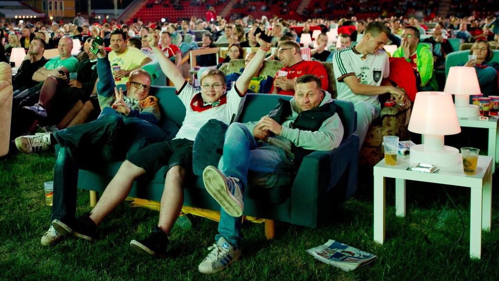 People sit on sofas in the Alte Foersterei Stadium, home to second Bundesliga league team Union Berlin. Photograph: Inga Kjer/EPA