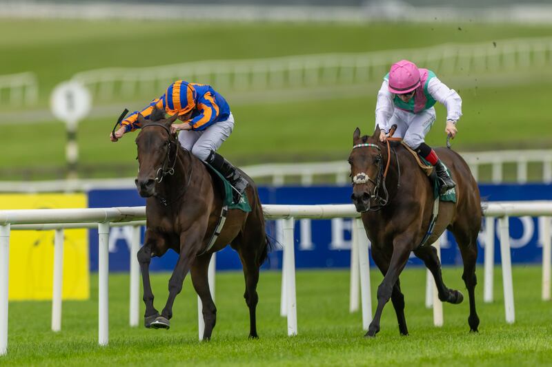 Whirl, under Ryan Moore, holds off Kalpana and Colin Keane to win The Paddy Power Pretty Polly Stakes (Group 1). Photograph: Morgan Treacy/Inpho