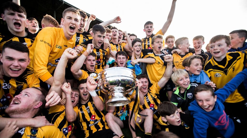 Dunboyne celebrate with the trophy after their victory over Summerhill in the Meath SFC Final at Páirc Tailteann in Navan. Photograph: Tommy Dickson/Inpho