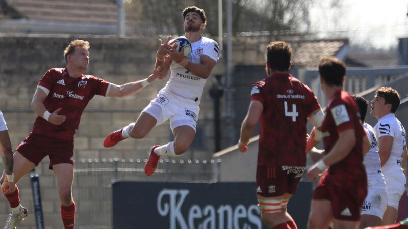 Toulouse’s Romain Ntamack leaps to claim the ball above Munster’s Mike Haley. Photograph: Donall Farmer/PA