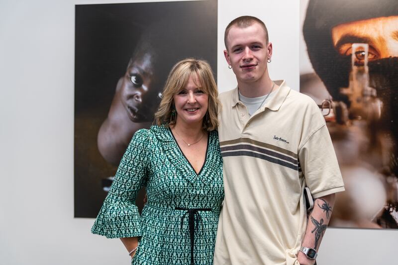 Tara Mills and her nephew Finn at an exhibition of Richard's work in Zimbabwe