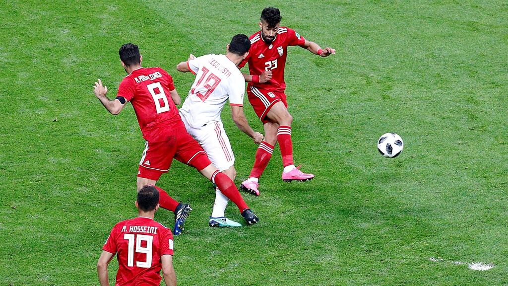 Diego Costa scores Spain’s goal after a clearance attempt by Iran’s Ramin Rezaeianin bounced off his leg in World Cup Group B game in Kazan. Photograph: Photograph: Sergey Dolzhenko/EPA