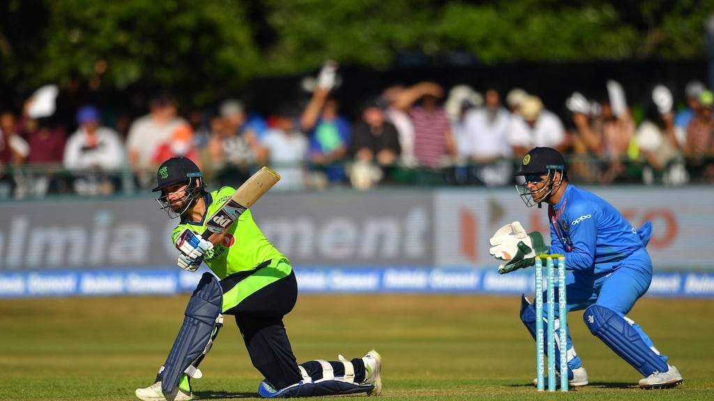 James Shannon of Ireland swats one away as MS Dhoni watches on. Photo: Seb Daly/Sportsfile