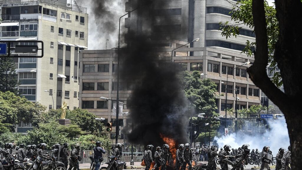 Police clashed with demonstrators who blocked roads and rallied against Sunday’s ballot. Photographer: Carlos Becerra/Bloomberg