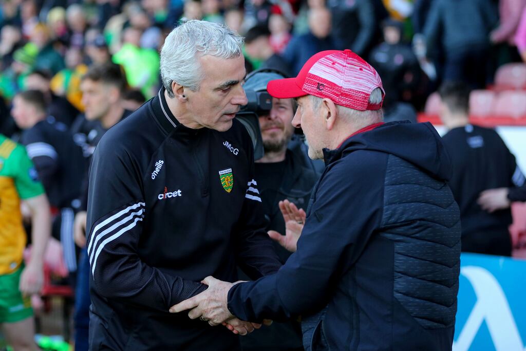 Donegal manager Jim McGuinness and Derry Manager Mickey Harte at the end of the Ulster SFC game on Saturday. Photograph: Lorcan Doherty/Inpho