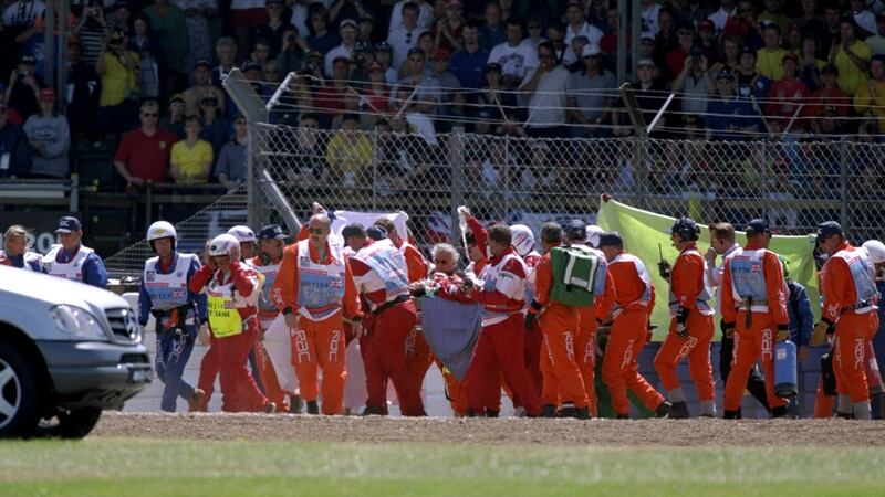 Doctors attend to Michel Schumacher after he hit a wall during the 1999 British Grand Prix. File photograph: Allsport