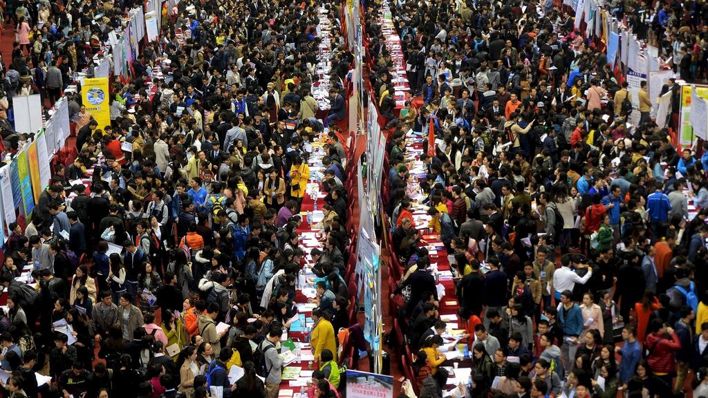 A job fair at Shandong University in China. Slower economic growth in China, worsening producer price deflation and a generally chillier global environment has prompted the Manila-based Asian Development Bank to cut its growth forecasts for developing economies in Asia.