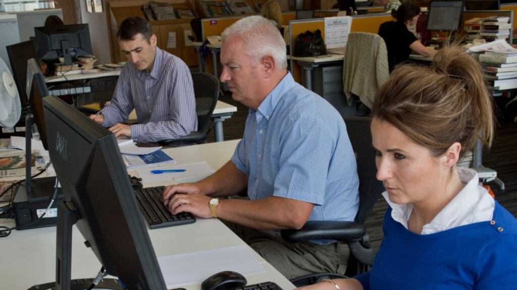 From left: Joe Humphreys, Irish Times Education Correspondent, with guidance counsellors Brian Howard and Deirdre Garrett, at the Exams Helpdesk. Photograph: Brenda Fitzsimons/The Irish Times
