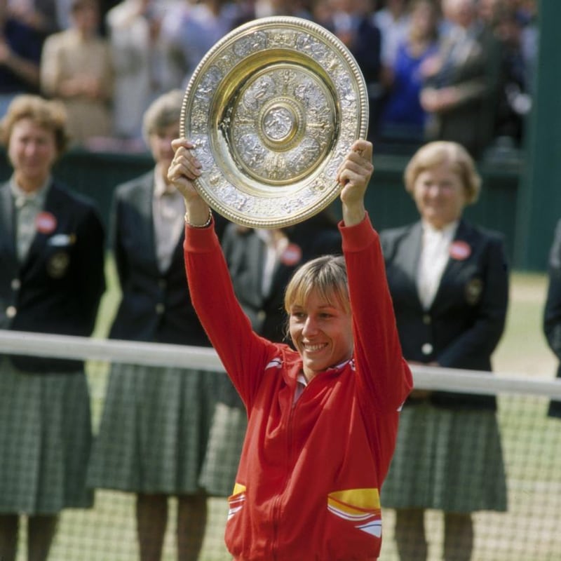 Martina Navratilova lifts the Venus Rosewater dish after beating Chris Evert in the 1982 Wimbledon final. Photograph: Tony Duffy/Getty Images