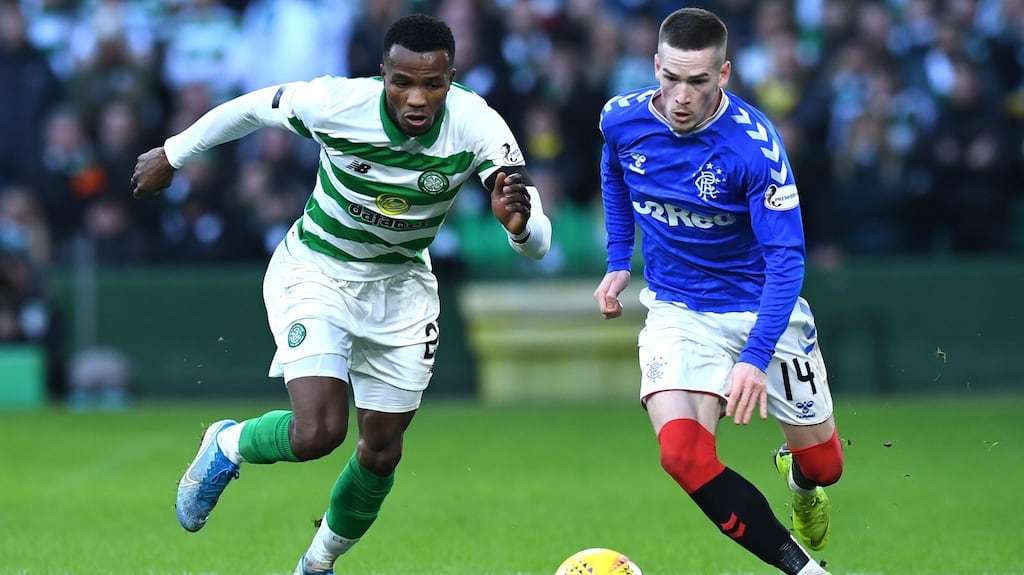 Boli Bolingoli of Celtic chases Ryan Kent of Rangers during the recent Old Firm derby. Photo: Mark Runnacles/Getty Images