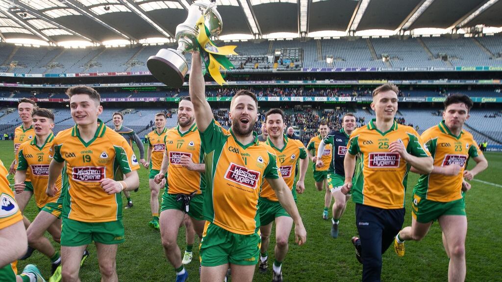 Corofin’s Michael Lundy holds aloft the Andy Merrigan Cup after their victory over Dr Crokes in the All-Ireland senior club football championship final at Croke Park. Photograph: Tommy Dickson/Inpho