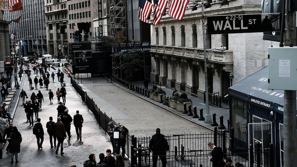 Wall Street sank on Tuesday, continuing a punishing month for US stocks, as dismal outlook from industrial bellwethers Caterpillar and 3M sparked concerns over corporate growth