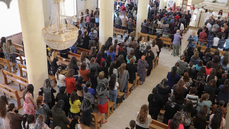 Christians celebrate Mass in Mar Gewargis (St George) Chaldean Catholic church, which was damaged by Islamic State militants, in the town of Tel Esqof, Iraq, on Easter Sunday. Photograph: Reuters
